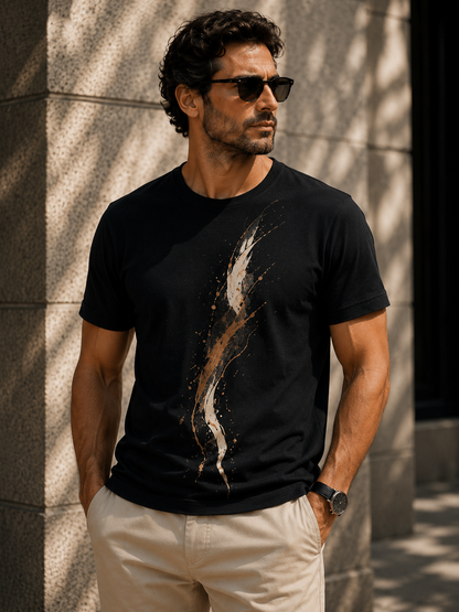 Man wearing Golden Sweep men's abstract graphic T-shirt with expressive golden brushstroke artwork