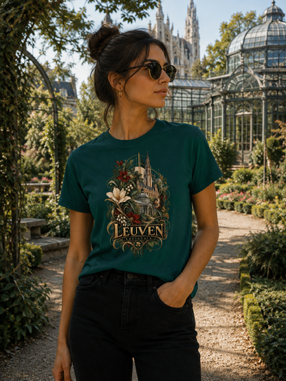 A women wearing a Green Leuven Belgium souvenir graphic T-shirt featuring historic architecture surrounded by flowers and botanical artwork in antique gold and burgundy