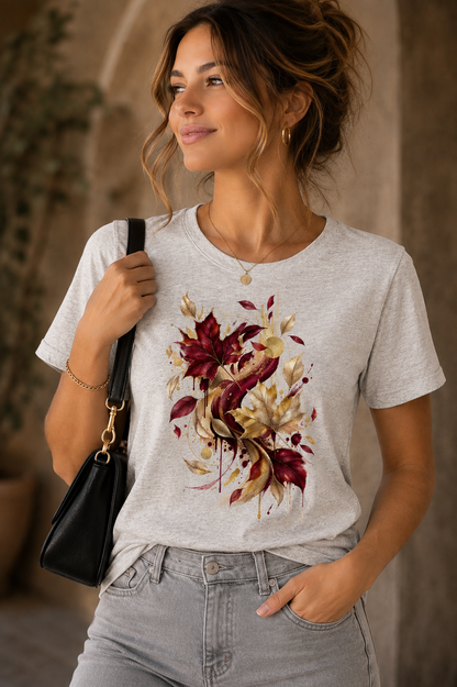 Woman wearing Autumn Colors seasonal graphic T-shirt with burgundy, gold and beige abstract autumn leaves