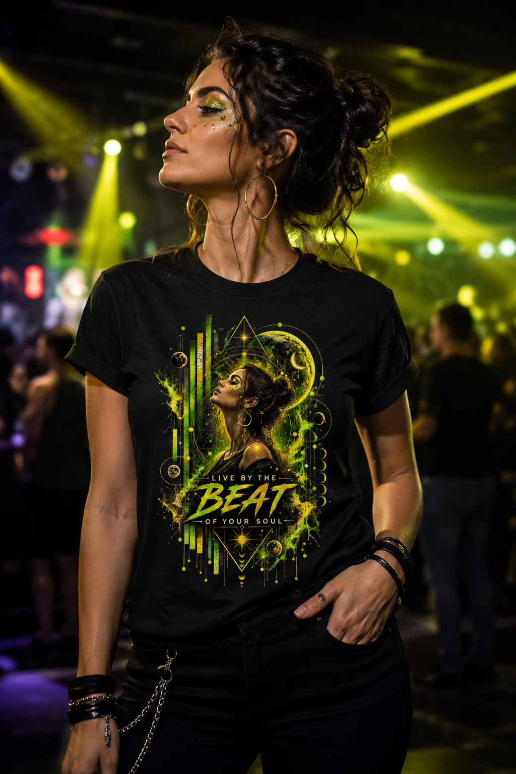 Woman wearing the Live by the Beat women’s rave graphic T-shirt with lime green and yellow celestial artwork at a techno party.