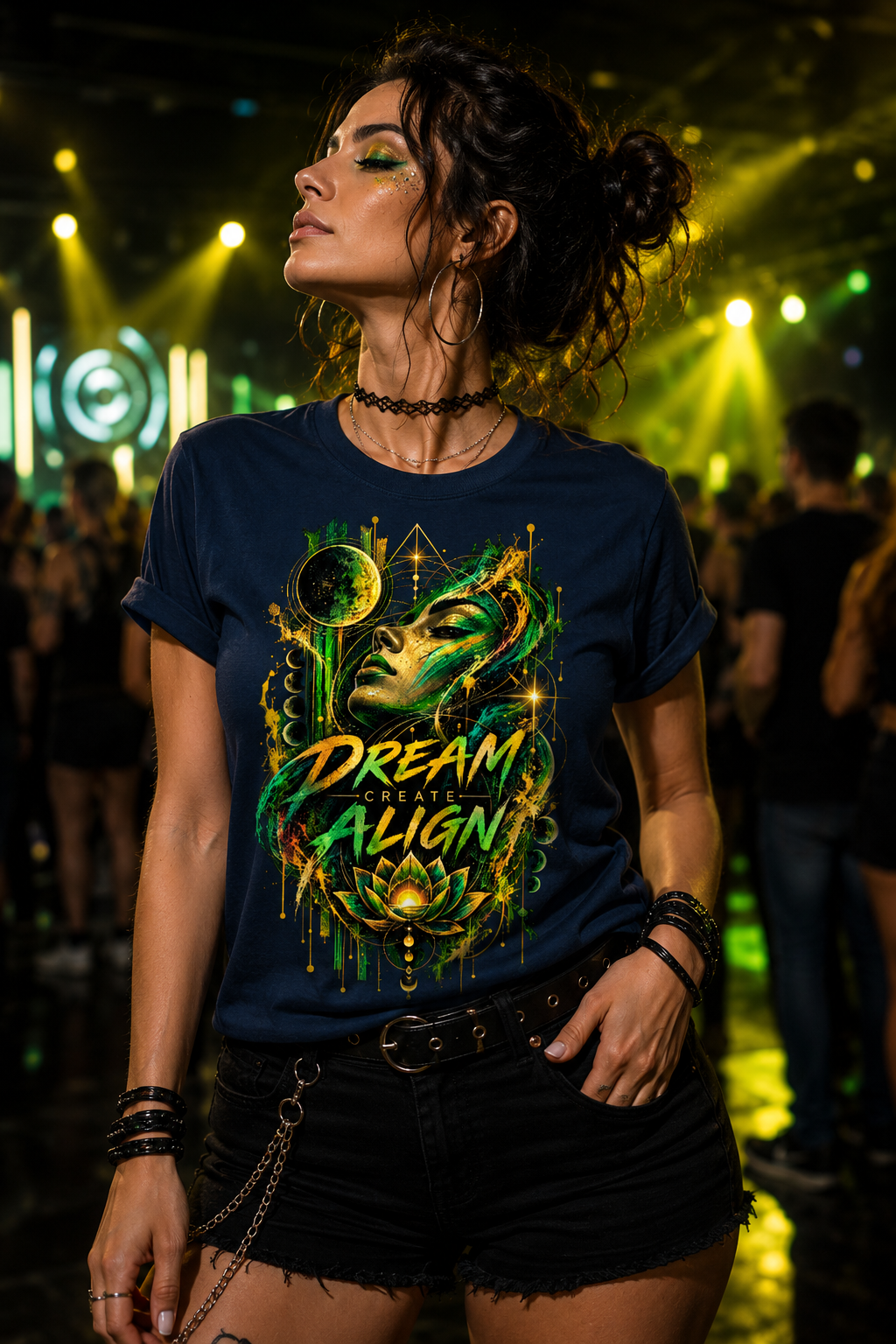 Woman wearing the Dream. Create. Align women’s rave graphic T-shirt with green, gold and celestial artwork at a techno party.