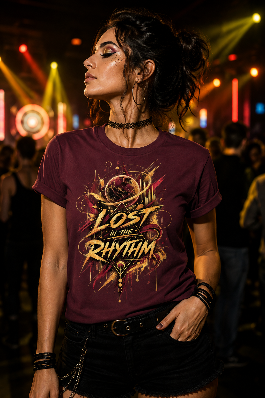 Woman wearing the Lost in the Rhythm women’s rave graphic T-shirt in burgundy with gold celestial artwork at a techno party.